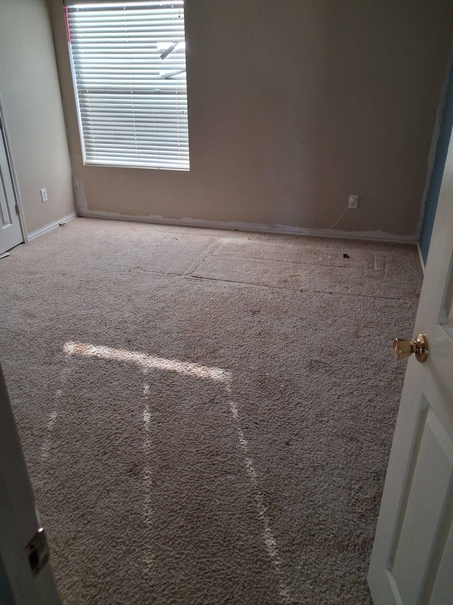 Cleared bedroom floor after furniture removal