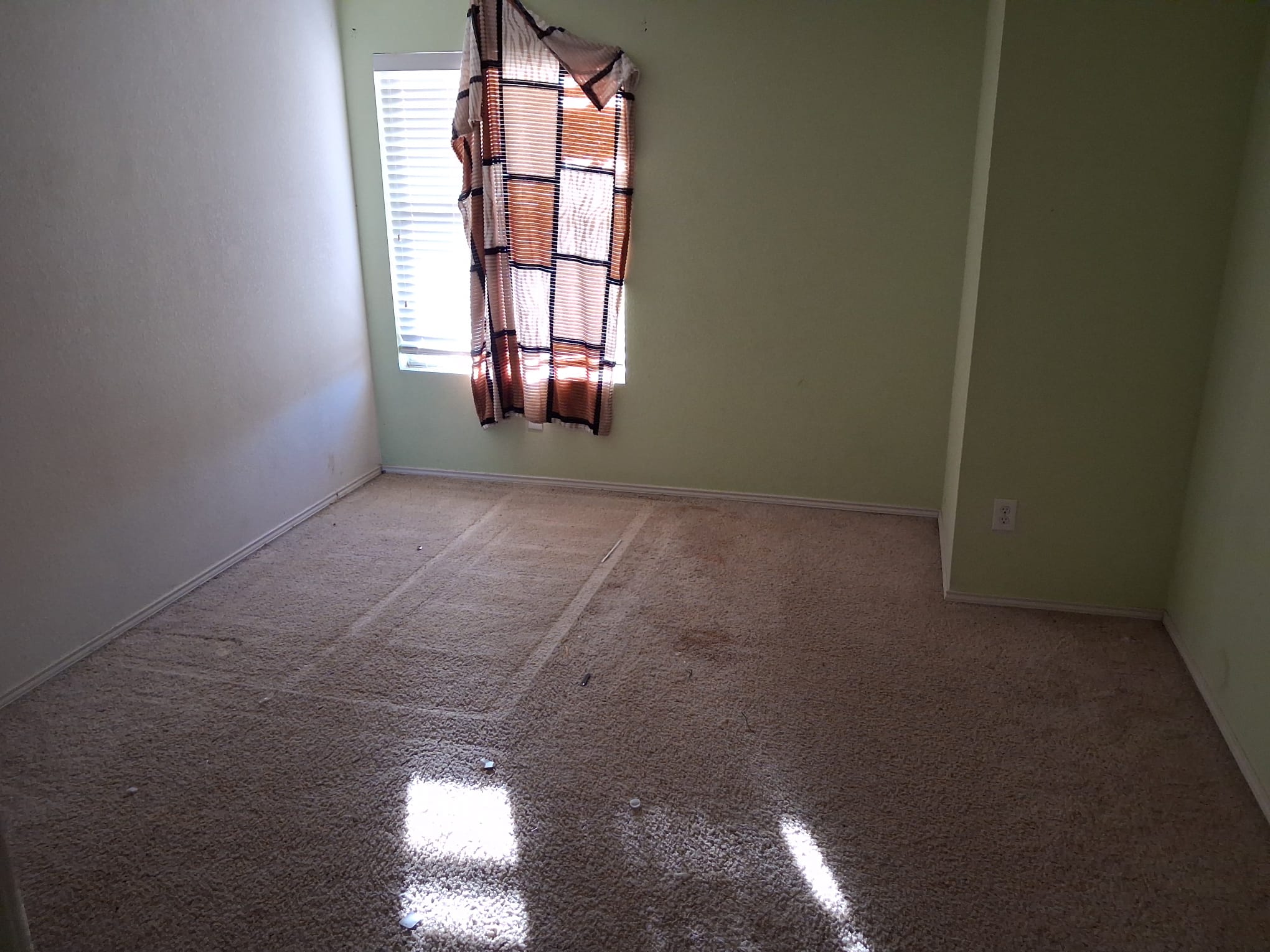 Empty tiled room after the home cleanout